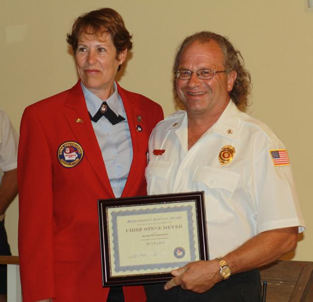 Garrison Fire Chief Steve Meyer receives award for 30 years of service.
