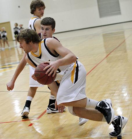 Chris Merchant dribbles past a Mustang defender.