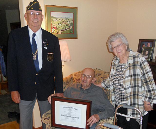 Clarence Hilner with wife, Beverly and Roger Uthoff; recently received his official WWII discharge.