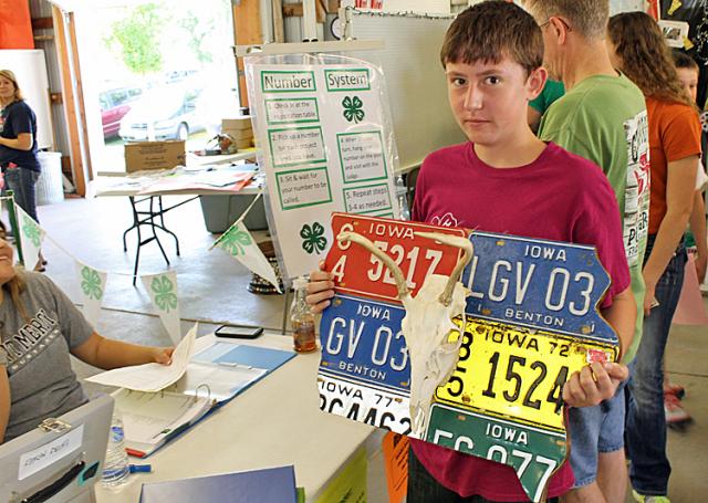 Clayton Sparks registers his Iowa-themed project Wednesday morning at the Fair.