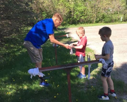 Center Point Historical Society President Andersen helped to teach the CPU children this fine art of hanging out clothes on a clothesline.