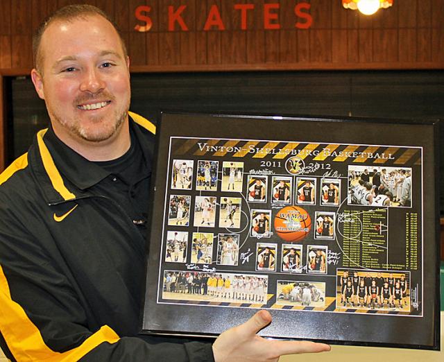 Coach Johnson with the framed poster commemorating the 2011-12 season.