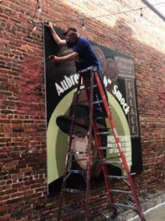 Attaching the mural to the Palace Theatre wall