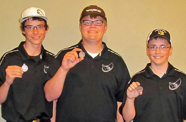 Conference medalists: Tyler Stueck (7th) Grant Noren (3rd) and Austin Carolus, (10th).