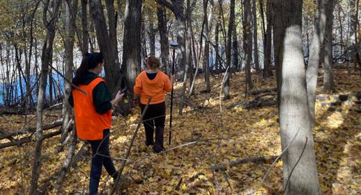 Conservation staff collecting GPS  coordinates at Minne Estema State Park. Click to read article