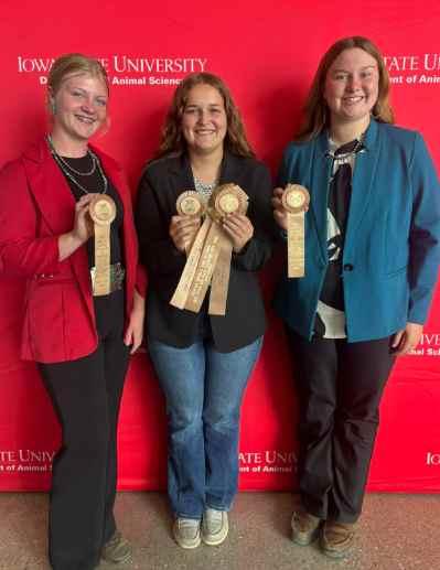 Caleigh Lewis, Bella Edler, and Kinze Manson with their 8th place ribbon. . Click to read article