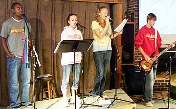 Amy second from left sining with the Campus Crusade Band at Iowa State