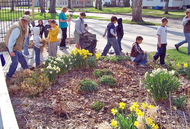Cub Scouts and their families helped the Garden Club with spring cleaning at Ray House.