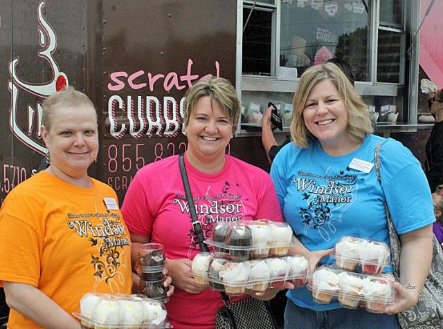 Cupcake day: Barb Johnson, Lisa Staab and Carrie Hantz were among those enjoying them at FSB.
