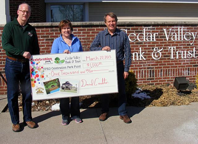 Jon Clingman accepts a Celebration Park donation from Wendy Riggle and Dave Coulter of CVBT.