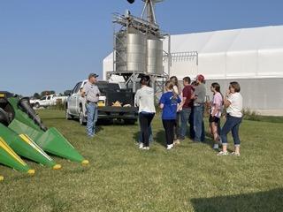 FFA members learning about corn and all of the aspects of a combine.