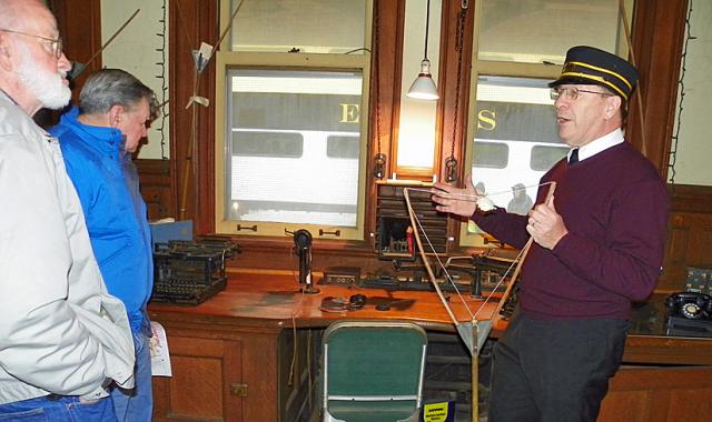 Phil Borleske shares some history of the depot and its telegraph with Holiday Express riders.