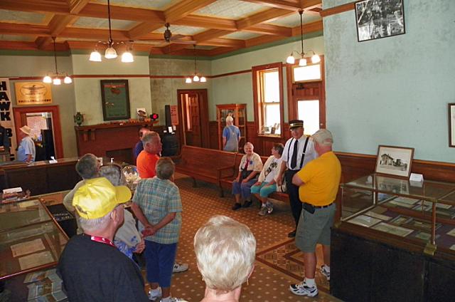 Railroad historian Phil Borlesky gives the Winnie Hawks a tour of the Depot.
