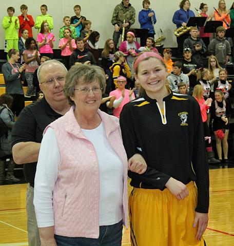 CPU player Allison Wooldridge escorted her 6th grade teacher, Dilyn McNeill.
