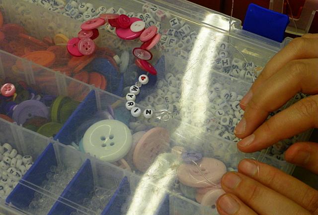 Regina Malaska sold bracelets with pet names during the VGH Dog-A-Fair.