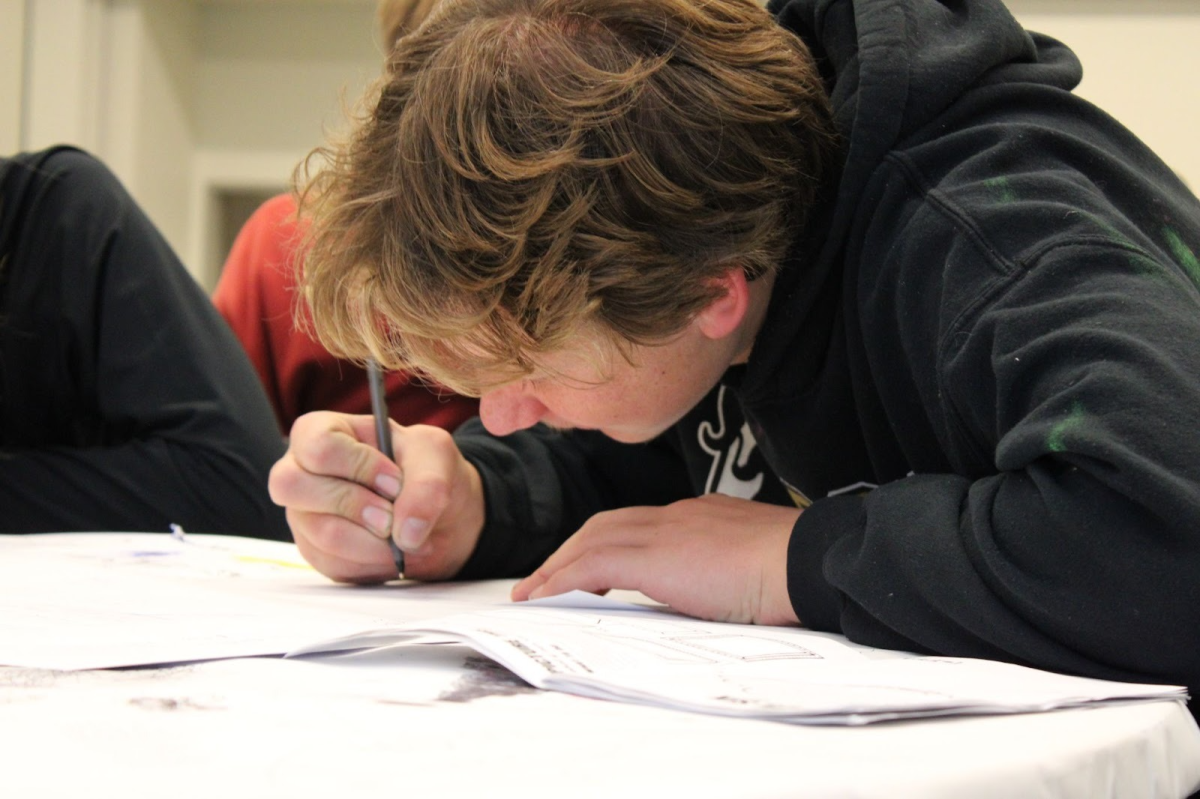 Jackson Lloyd writing a letter to his future self. 