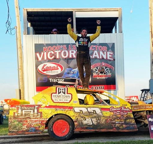 Jarett Franzen celebrates atop his Friesen Performance IMCA Northern SportMod after winning the division’s 18th anniversary race May 29 at Benton County Speedway. He took home $1,800 for his efforts.