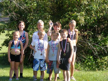 The winners of the Triathlon pose for a photo.