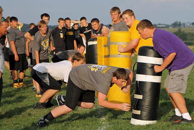 Football Camp: Vikings worked on the fundamentals of blocking and tackling.