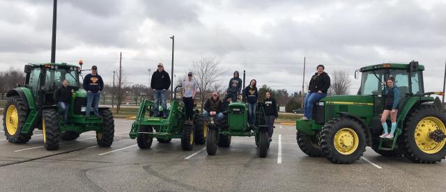 Vinton Shellsburg's Future Farmers of America arrive in their tractors during FFA Week at the school