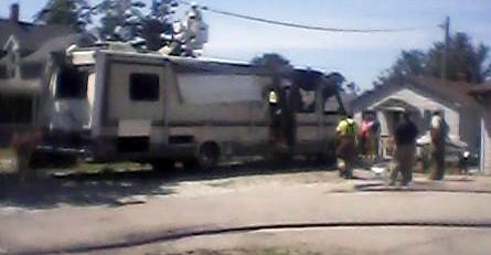 Firemen and utility workers respond to the fire.