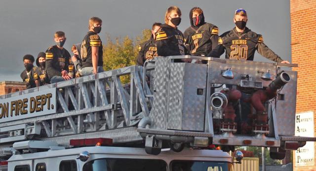 The Vinton-Shellsburg Football Team arrives to cheers during the homecoming parade