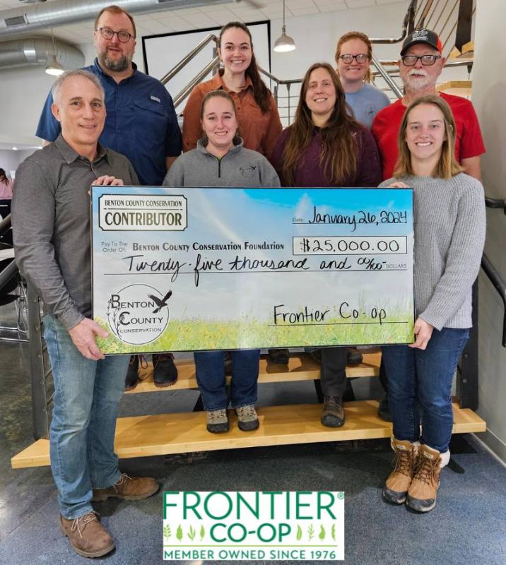 Tony Bedard presents check to Benton County Conservation on behalf of of Frontier Co-op