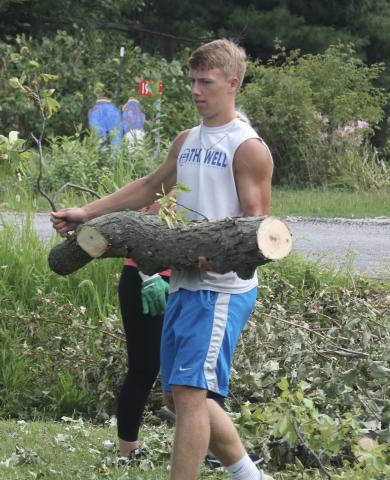 Viking senior Elijah Kalous helping out a neighbor.