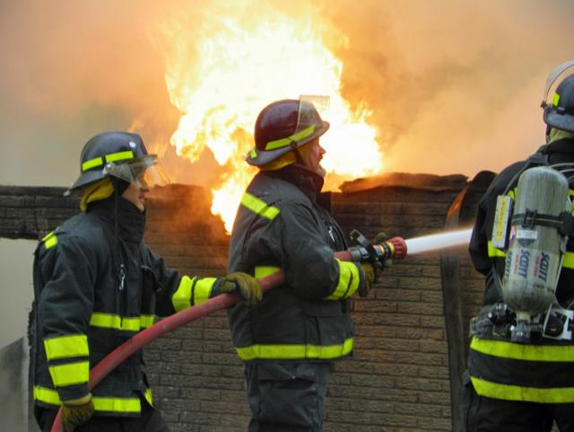 Brandon firemen fight a fire at the Lester Geiger home on 24th Ave. Drive Wednesday, Dec. 15.