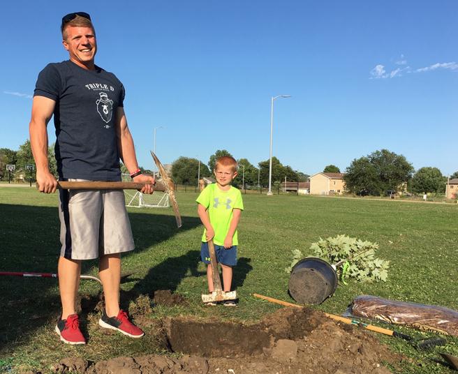 Eric and Gram getting ready to plant a maple tree