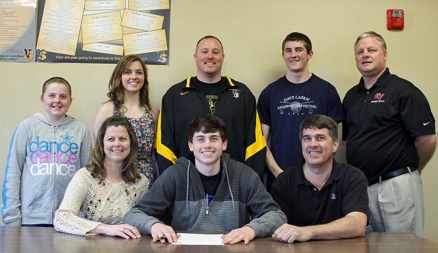 Grant Sagan's siblings Josie, Anna, Nolan joined him, his parents and coaches for the signing.