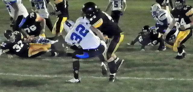 Gunner Tranel bangs past a Raider defender for one of his 4 TDs; he ran for 226 yards.