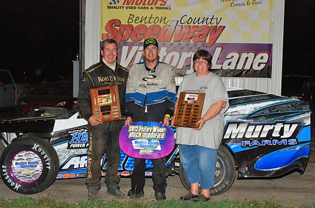 Richie Gustin poses in Victory Lane after winning the Hogan Memorial.
