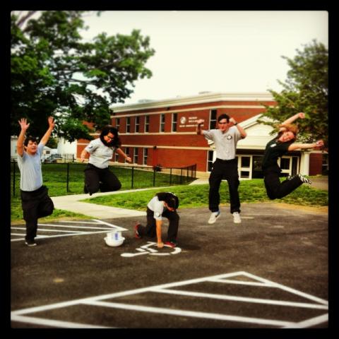 Hickory 2 jumps for joy outside the Boys and Girls Club after a successful Community Day