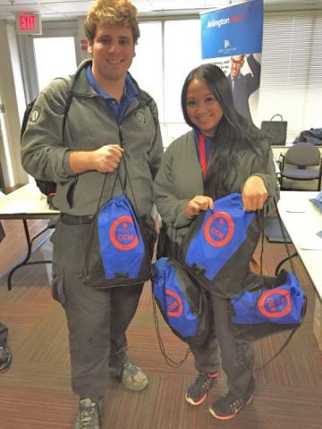 Alex and Joy pose with emergency preparedness kits
