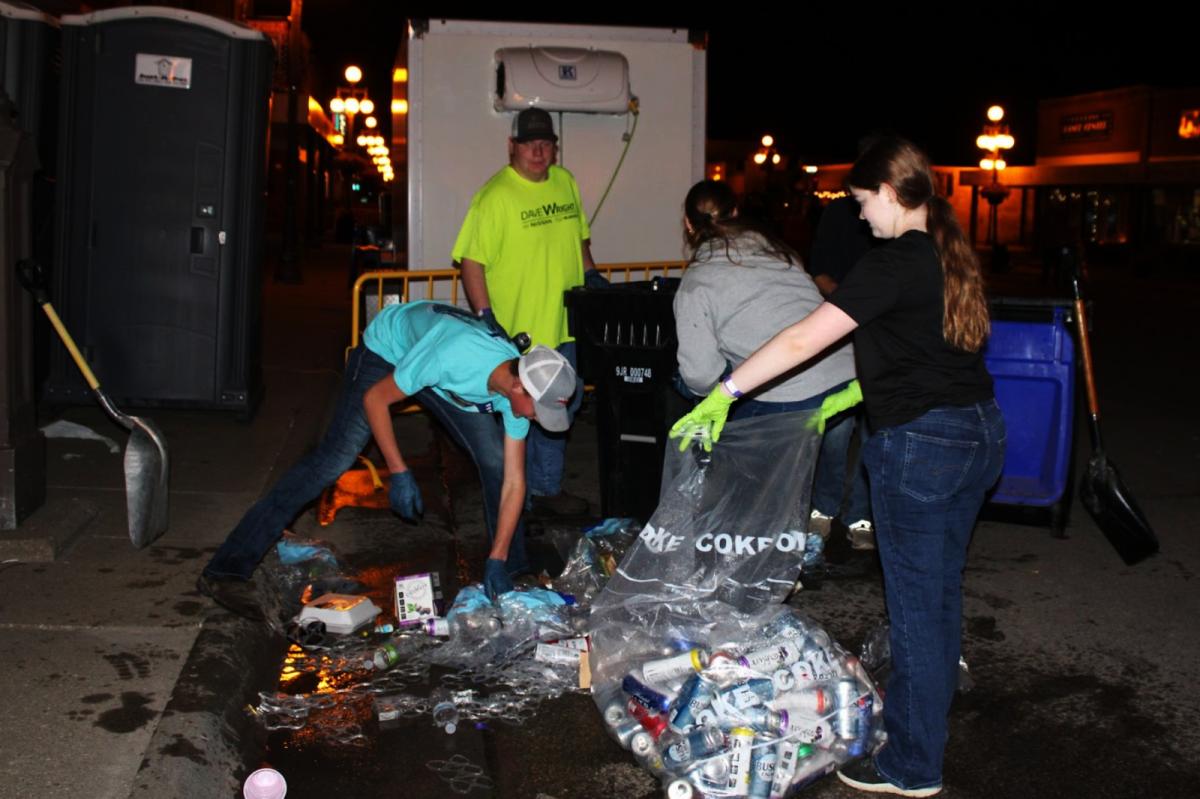 Braedon Hepker, Will Kreutner, Abby McKenna, and Madeline Pingenot helped clean up cans.. Click to read article