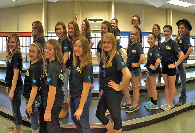 VSMS choir members wear shirts with blue hearts in honor of Emma Redlinger, who loved singing.