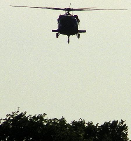 A National Guard Black Hawk helicopter makes a training landing in Vinton Thursday.