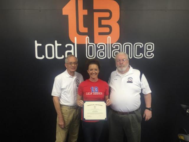Squat Challenge:Julie Lessig gave Honor Flight reps George Rickey & Jim Cerveny the $2,575 raised.