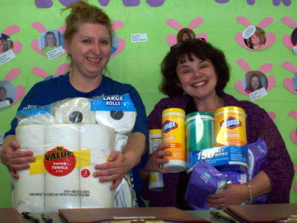Sharyl Rupert of Happy Time and Susan Lent of TTT pose with items the club donated recently.