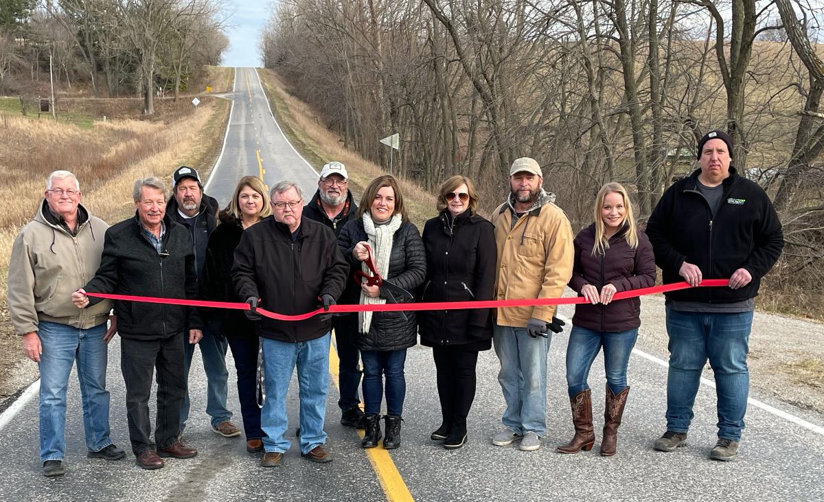 A symbolic ribbon cutting held Friday on the Benton/Iowa Road celebrating the partnership of economic development groups in Benton and Iowa counties