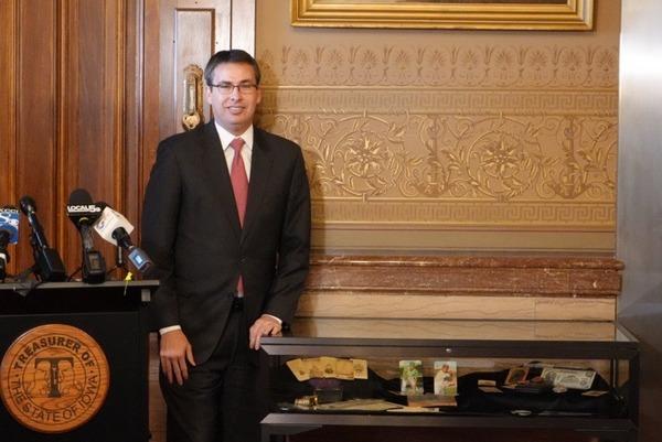 Treasurer Smith stands next to new display in the Iowa Capitol on January 28, 2026. Photo is available for media use with credit to Iowa Treasurer's Office.