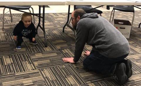 The cutest democrat caucus attendee in the 2nd Precinct finding entertainment during the meeting