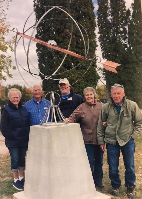 Cindy Elwick, Stan Geiken, Bill Strouf, Jeanne Mann and Ted Mann stand next to the armillary installed at Evergreen Cemetery.