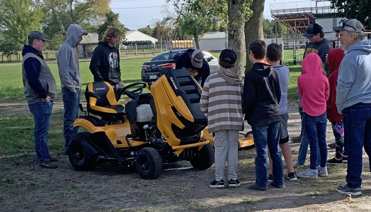 Clayton McKenna, Andrew Brummer, Kail Evans, and Gunnar Schminke teach about lawn mower safety