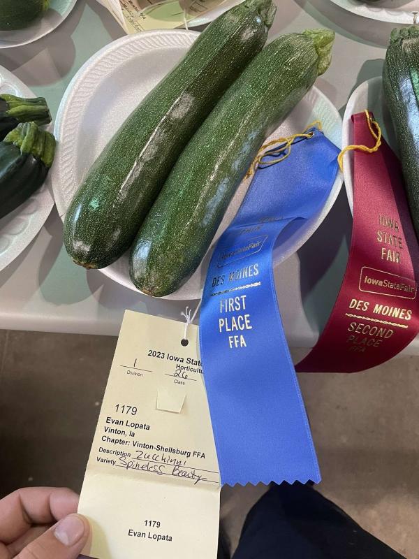 FFA member Evan Lopata and his first place zucchini.