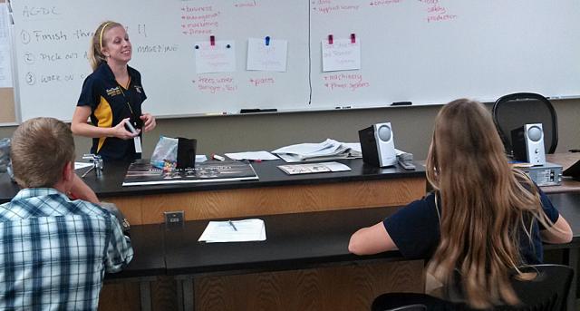 Ms. Kirschbaum speaks to the Greenhands.