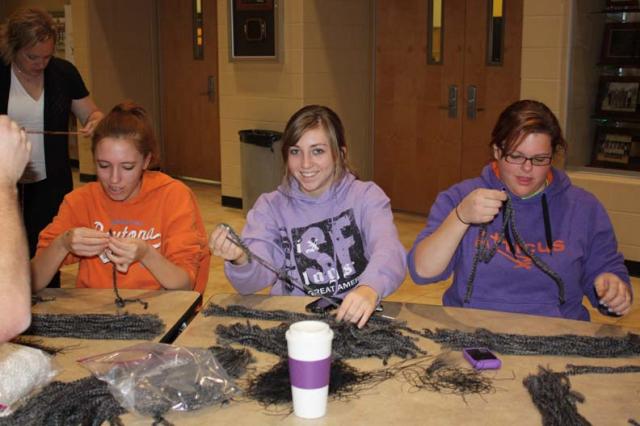 VSHS CATS cast members create their own cat wigs, based on the Broadway design