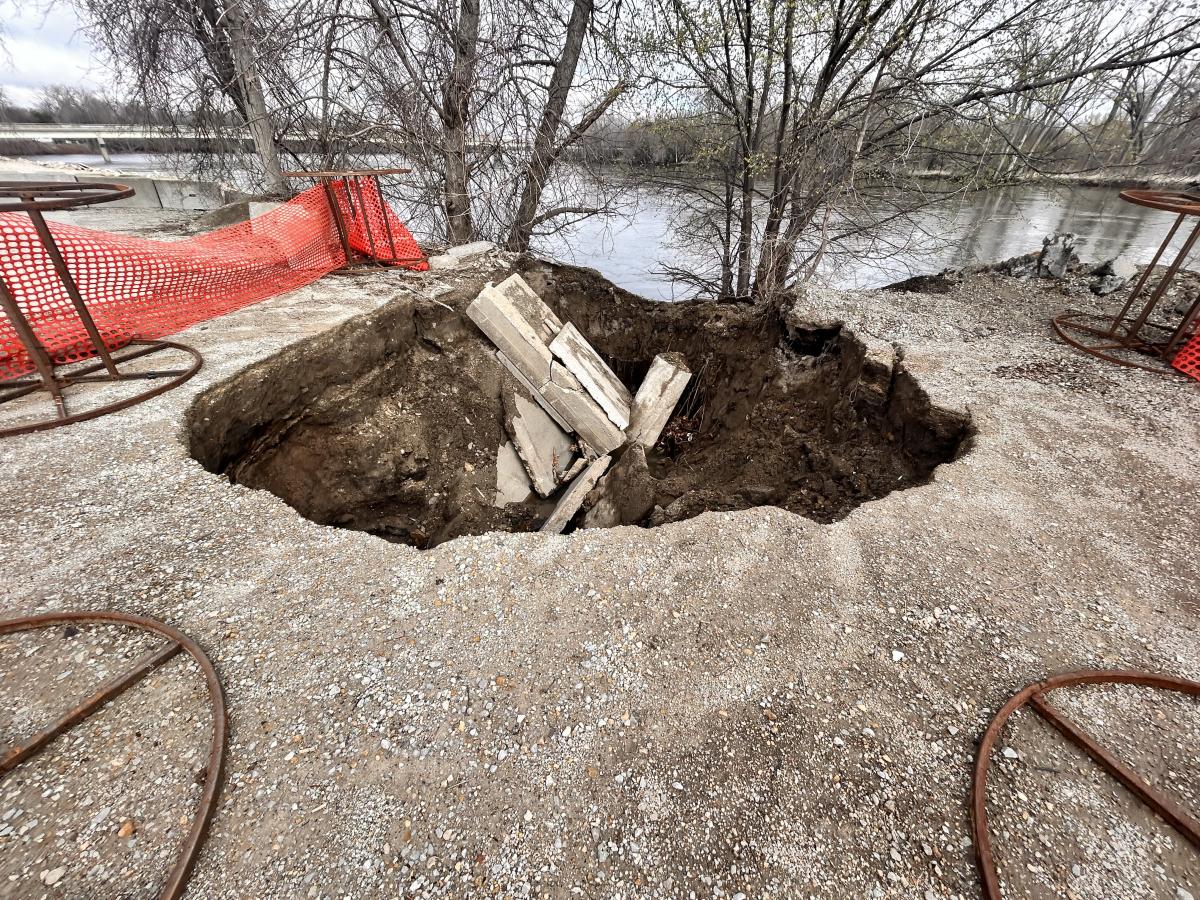 A storm drain collapsed along the riverbank.. Click to read article