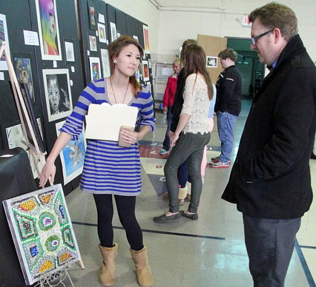 Kyra Blix discusses her project with her father John Paul.
